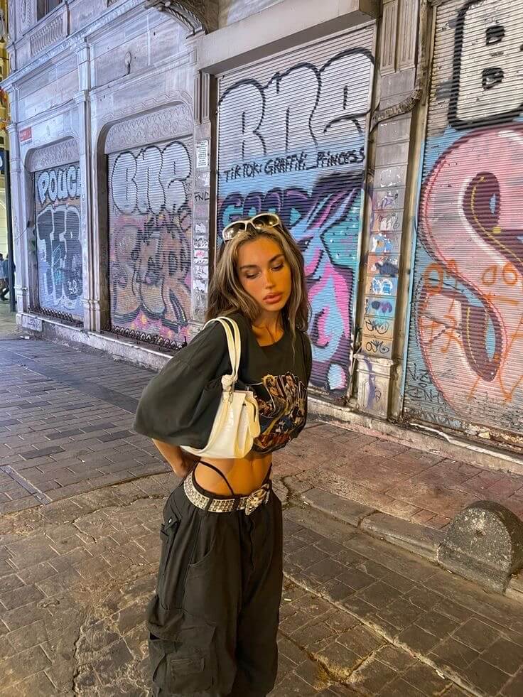 Woman wearing graphic t-shirt and black cargo pants