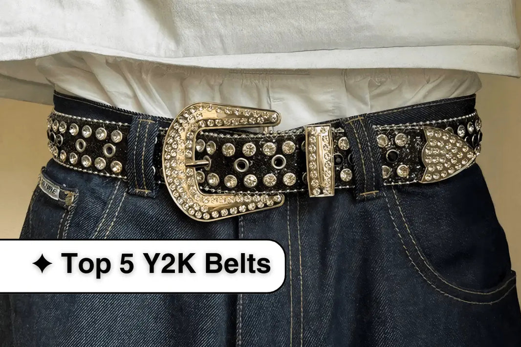 Studded black leather Y2K belt with ornate gold buckle styled with jeans.