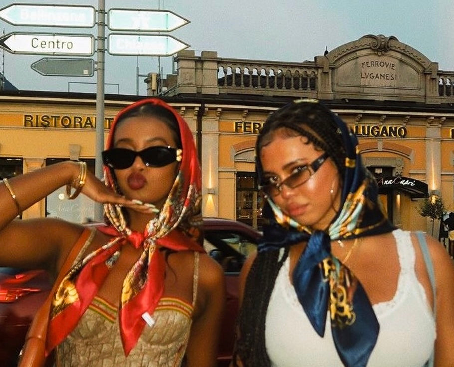 Two stylish women in colorful headscarves and sunglasses showcasing Womens Y2K Clothing.