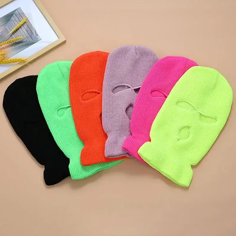 Colorful 3-holes ski masks arranged in a fan shape for winter sports and fashion