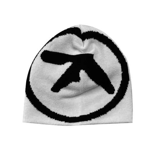 White knit aesthetic beanie featuring a black circular logo, perfect blend for Y2K style