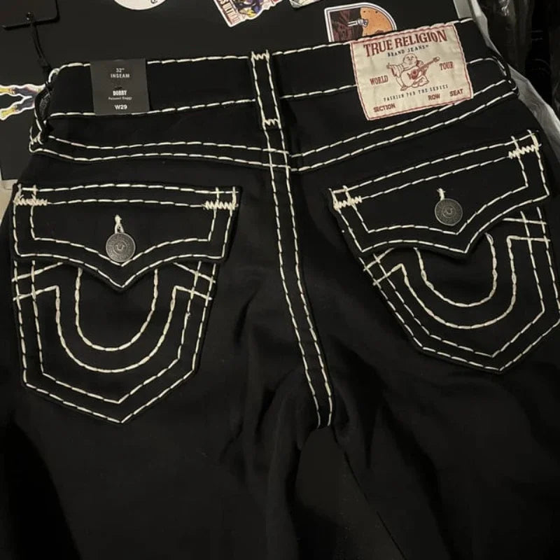 Black Back Pocket Jeans featuring white stitching and unique horseshoe pockets for Y2K style