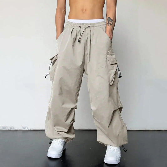 Beige baggy cargo pants with drawstring waist and multiple pockets for casual style