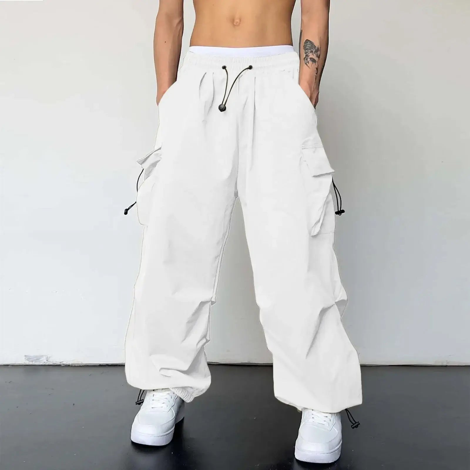 White baggy cargo pants with a drawstring waist and multiple pockets for versatile style