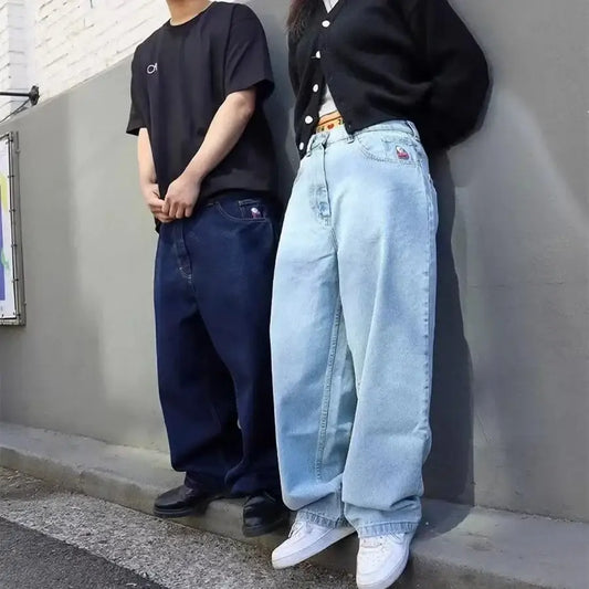 Two jeans guys in baggy jeans, showcasing contrasting dark and light outfits