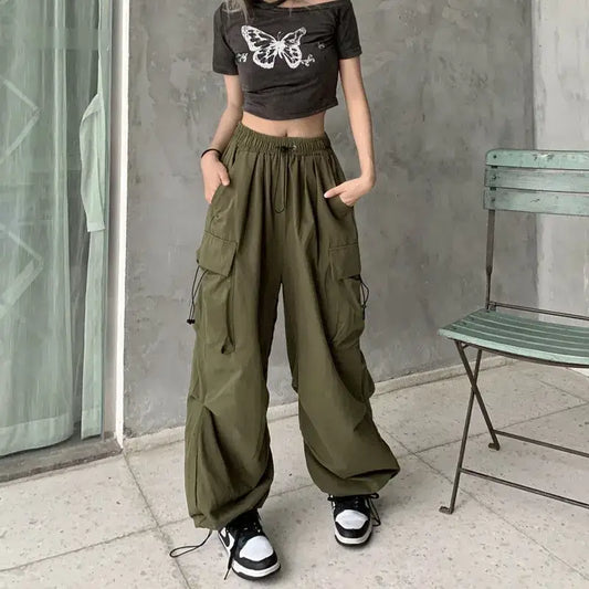 Olive green baggy pants woman with wide legs and multiple pockets for stylish comfort