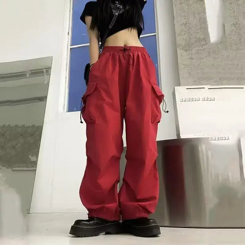 Red baggy cargo pants woman with side pockets and drawstrings for a stylish look