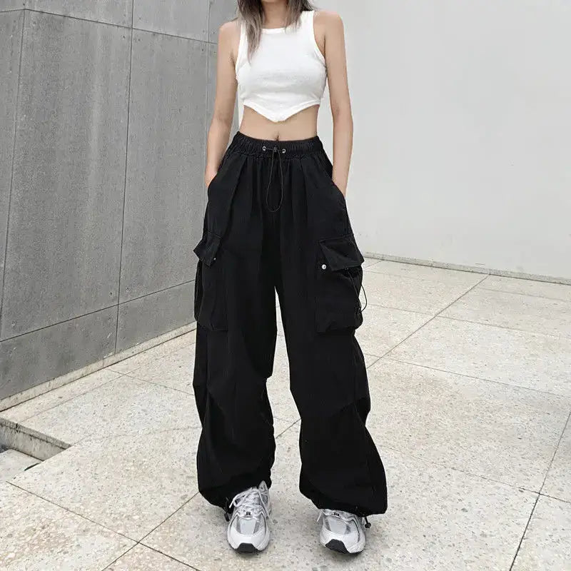 Wide-leg black cargo baggy pants woman with drawstring waist and multiple pockets