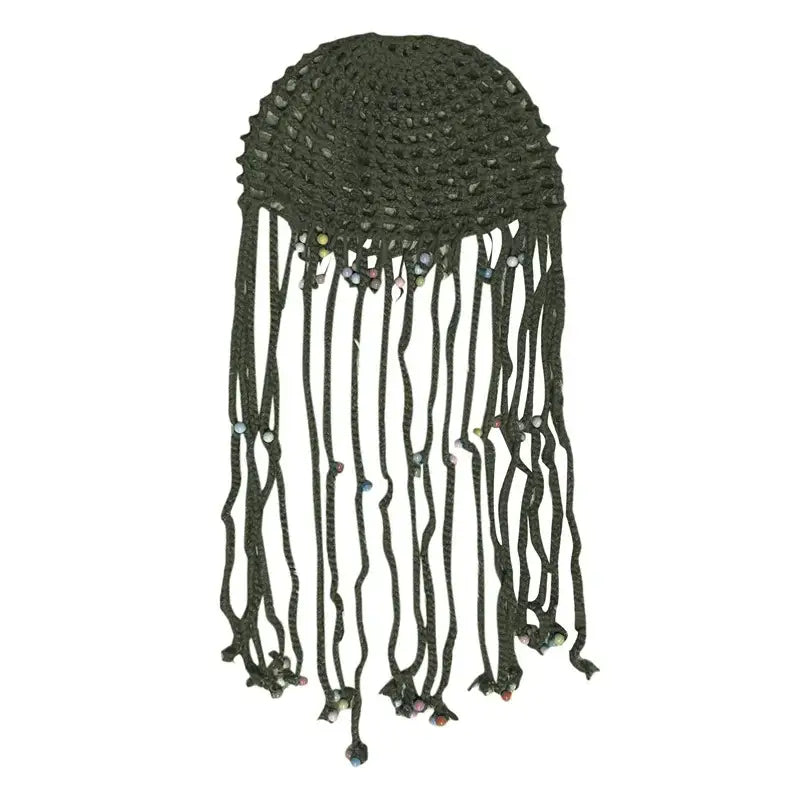 Crocheted green beanie hat with long tassels perfect for stylish winter warmth