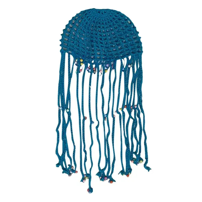 Teal beanie hat crochet with long tassels resembling a jellyfish design