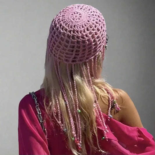 Pink beanie hat crochet with decorative beads worn over long blonde hair