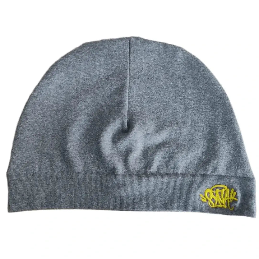 Gray knit beanie hat with yellow logo showcasing trendy beanie street style