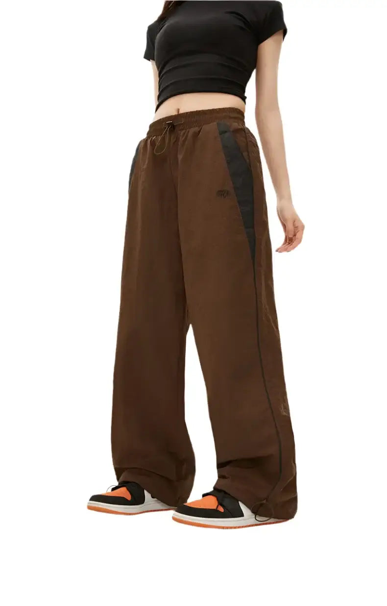 Wide-leg brown sweatpants with drawstring waist, perfect for black baggy pants style