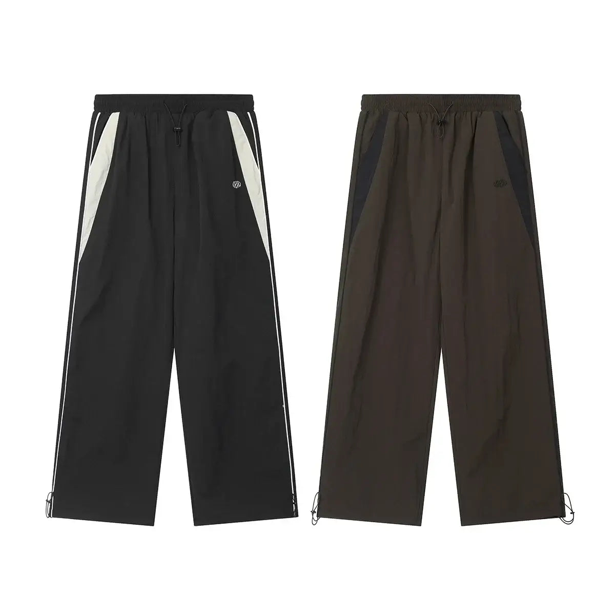 Two pairs of black baggy pants with contrasting side stripes for sporty style