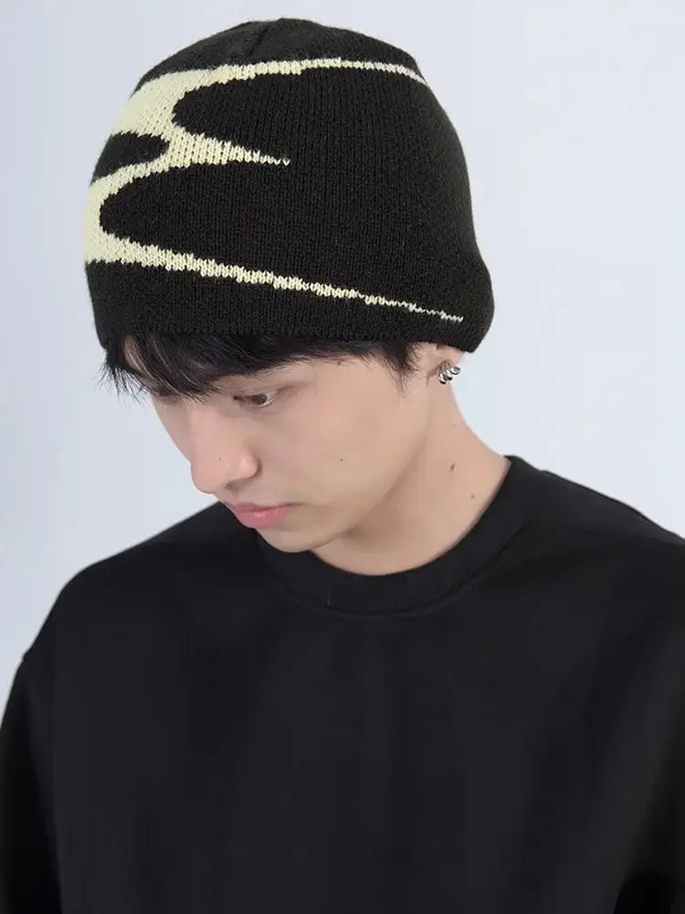 Black knit beanie featuring a white lightning bolt pattern, perfect Y2K accessory