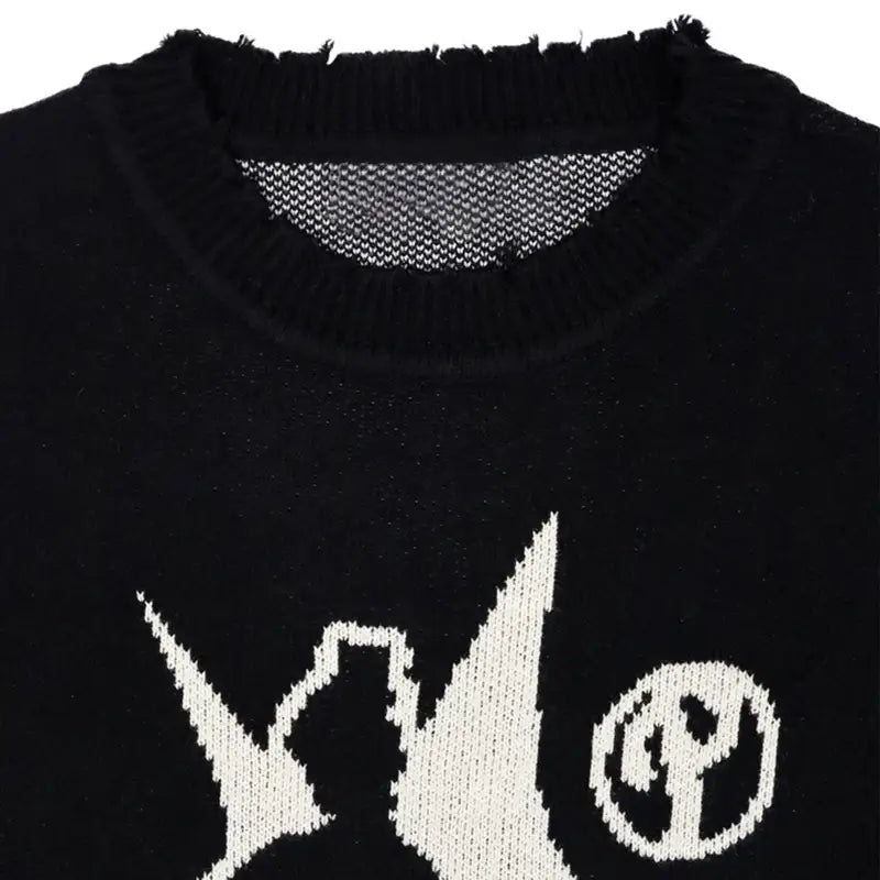 Black knit sweater featuring a stylish white graphic design on the front