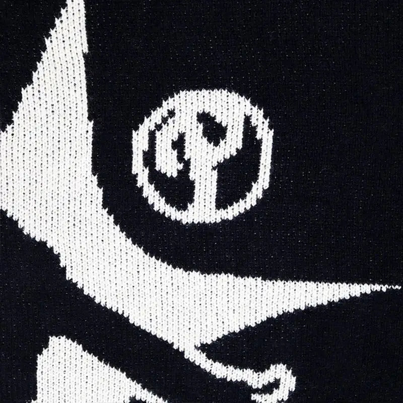 Black Knit Sweater featuring a white skull and crossbones design on black fabric