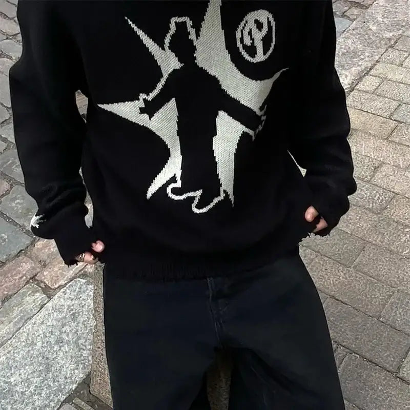 Black knit sweater with white graphic design of figure holding sword and flag