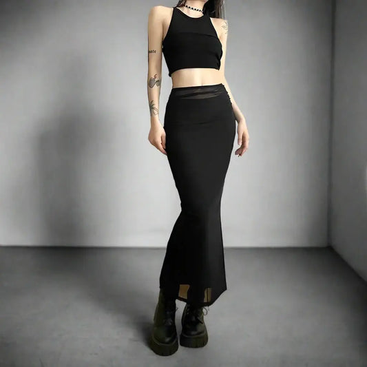 Black Y2K long skirt outfit featuring a crop top and chunky boots for a trendy look