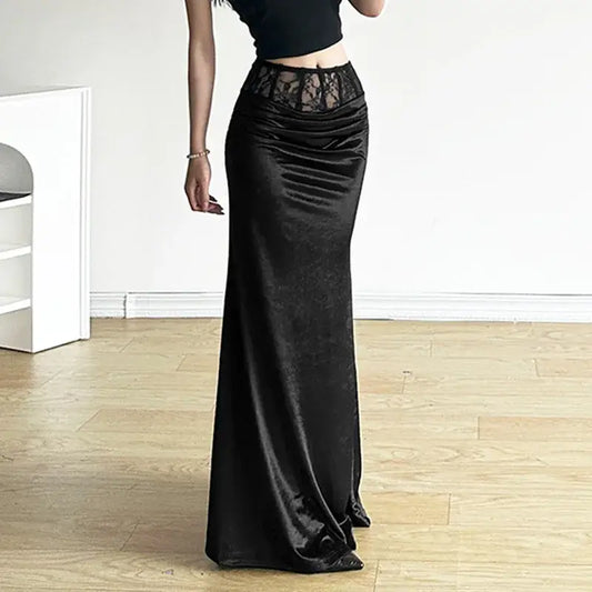 Long black velvet maxi skirt featuring a lace waistband for elegant style