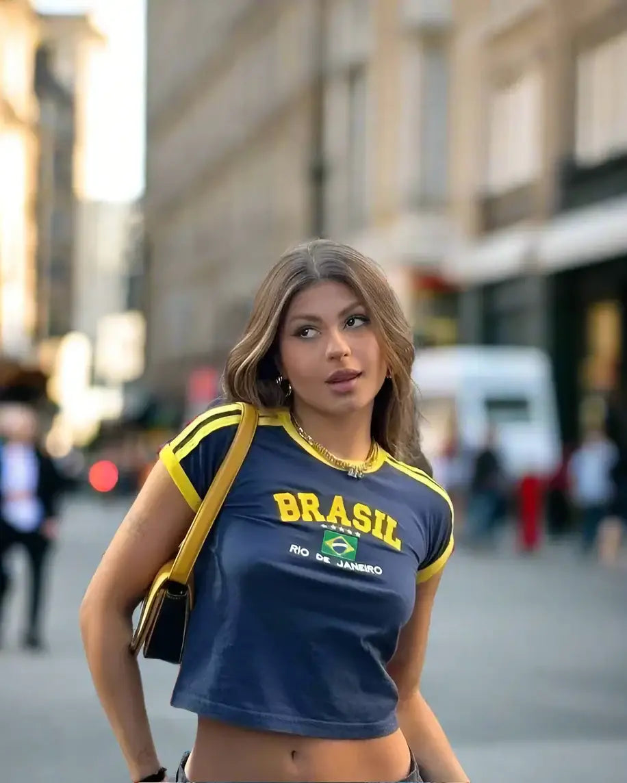 Woman in navy blue Brasil crop top with yellow trim, perfect for Y2K fashion