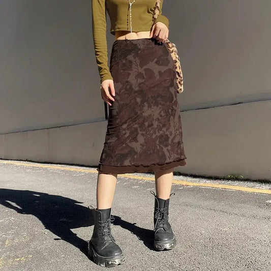 Brown flower skirt with floral pattern styled with black combat boots for a trendy look