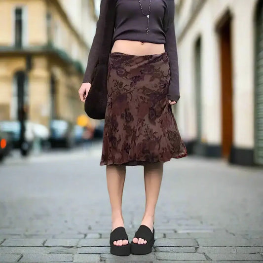 Brown Flower Skirt with floral pattern, black crop top, and stylish slide sandals