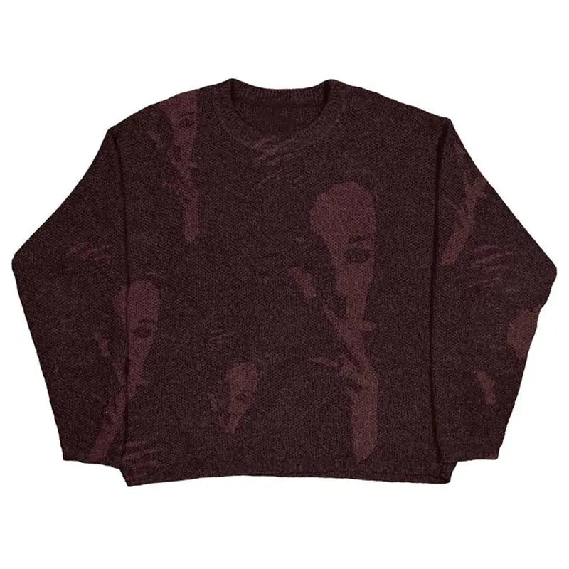 Dark burgundy cropped sweatshirt with faded graphic design on a brown knit sweater