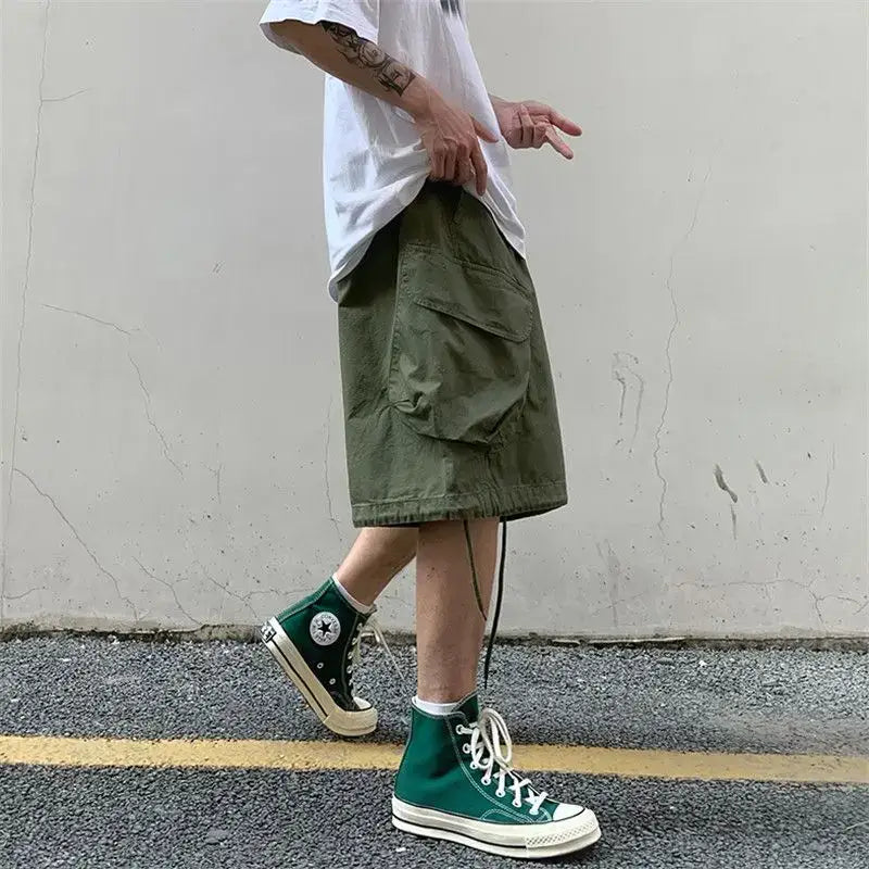 Person wearing green cargo shorts and high-top sneakers in Cargo Cargo Shorts