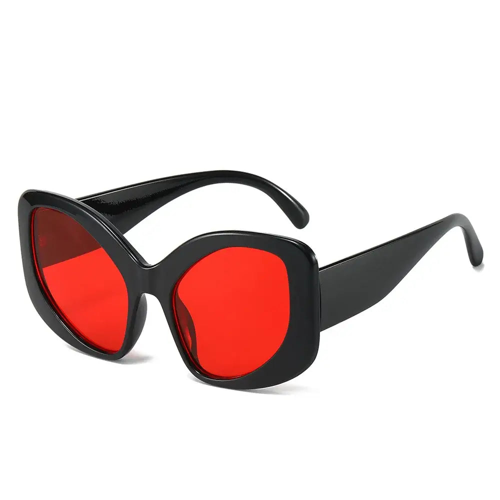 Oversized black Cat Eye sunglasses with bright red lenses for a bold look