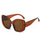 Oversized brown cat eye sunglasses with thick frames and dark lenses