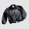 Black leather classic varsity jacket with WAHA graffiti-style lettering on the front