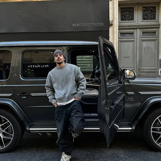 Black Mercedes-Benz G-Class SUV with open door showcasing Cosmic Knit Sweater