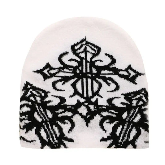 White Cross Beanie featuring intricate black tribal design for stylish warmth