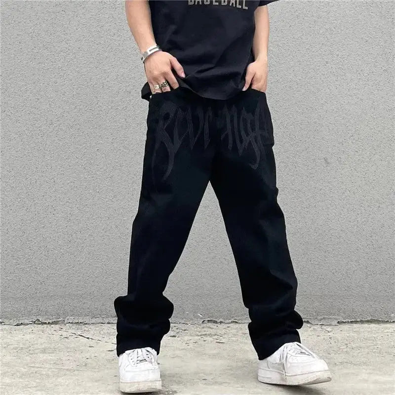 Black baggy pants styled with white sneakers, showcasing Custom Black Jeans fashion