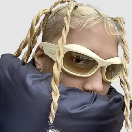 Person with blonde braids wearing oversized Cyber Y2K sunglasses for a stylish look