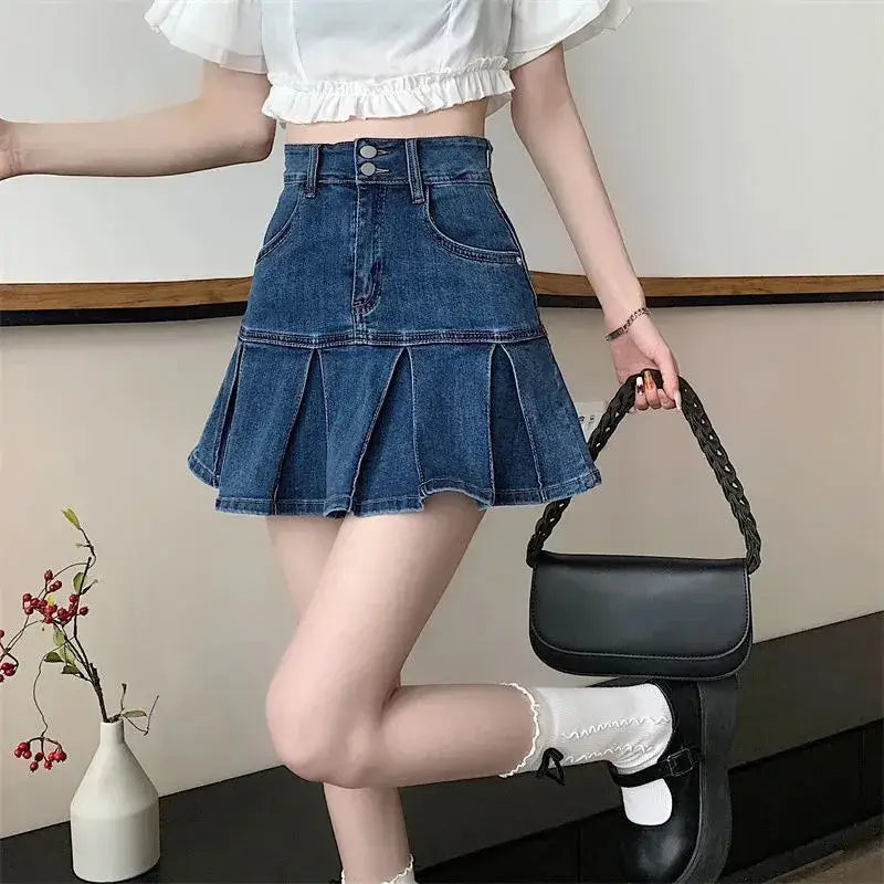 Pleated dark blue denim mini skirt with flared hem for trendy casual style