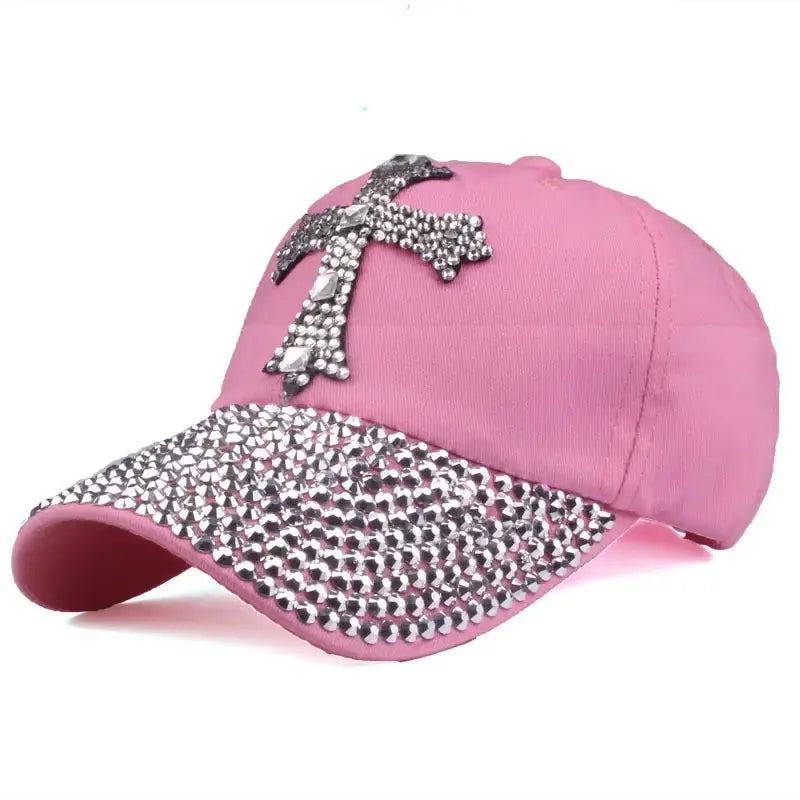 Pink denim baseball cap with a rhinestone-studded cross and brim design