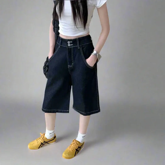 Wide-leg denim oversized shorts with a white crop top and yellow sneakers ensemble