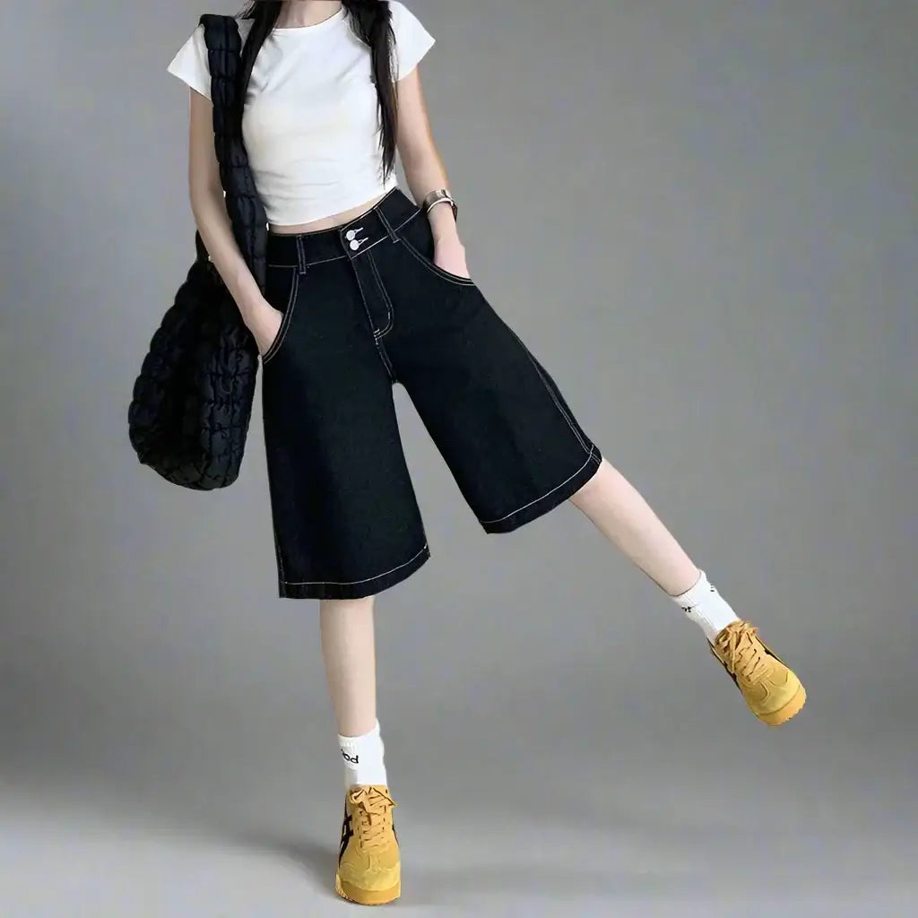 Wide-leg denim culottes with cropped white top and yellow sneakers, perfect denim oversized shorts