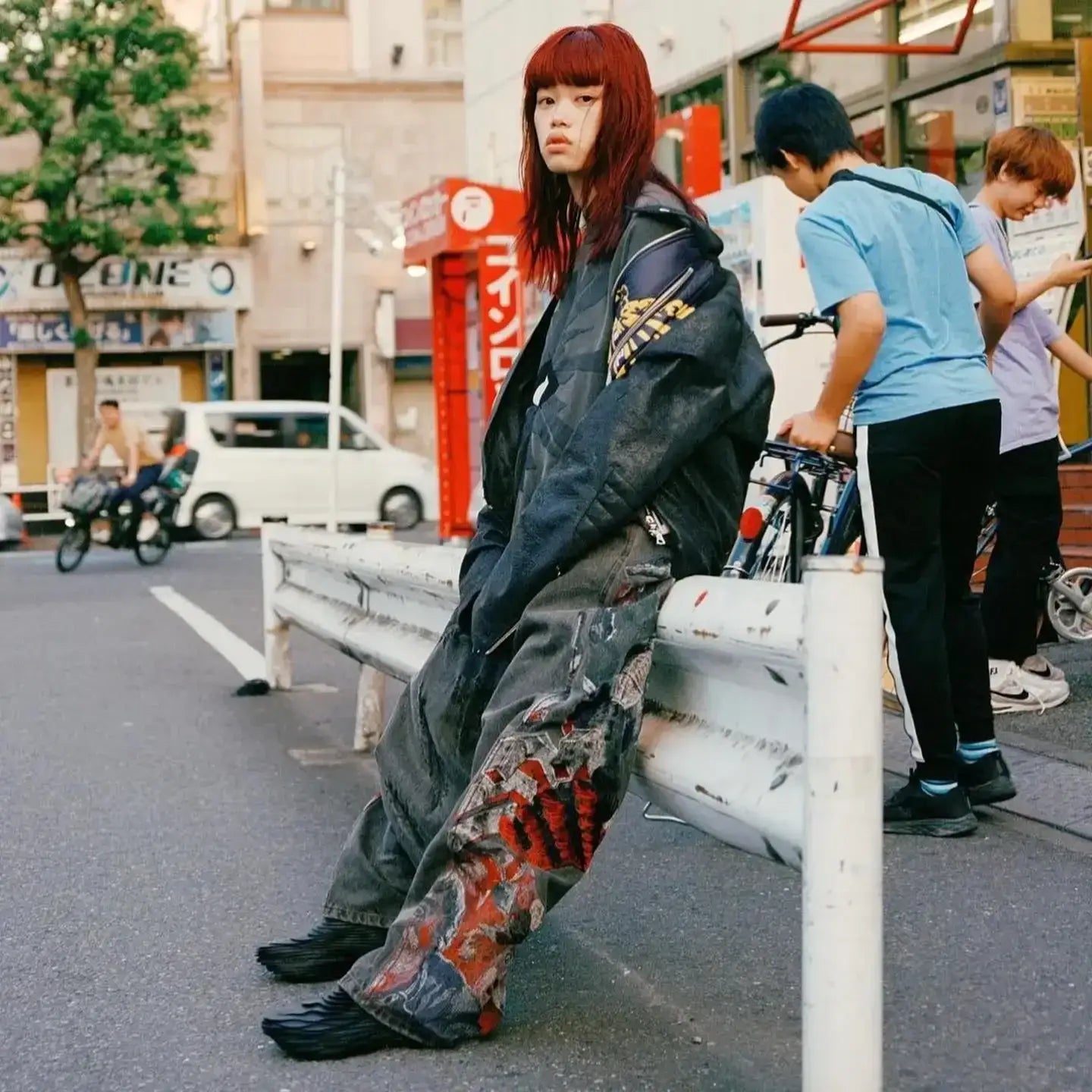 Woman with red hair in oversized jacket and colorful pants showcasing Embroided Y2K Jeans