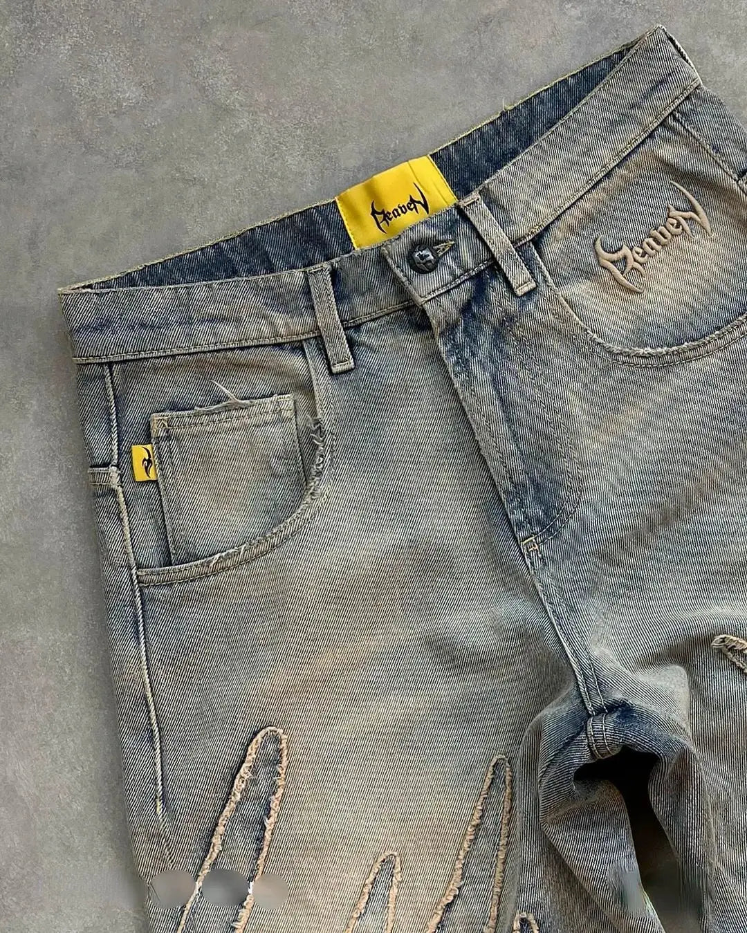 Faded blue wide leg Fire Jeans with yellow accents and distressed details, Y2K style