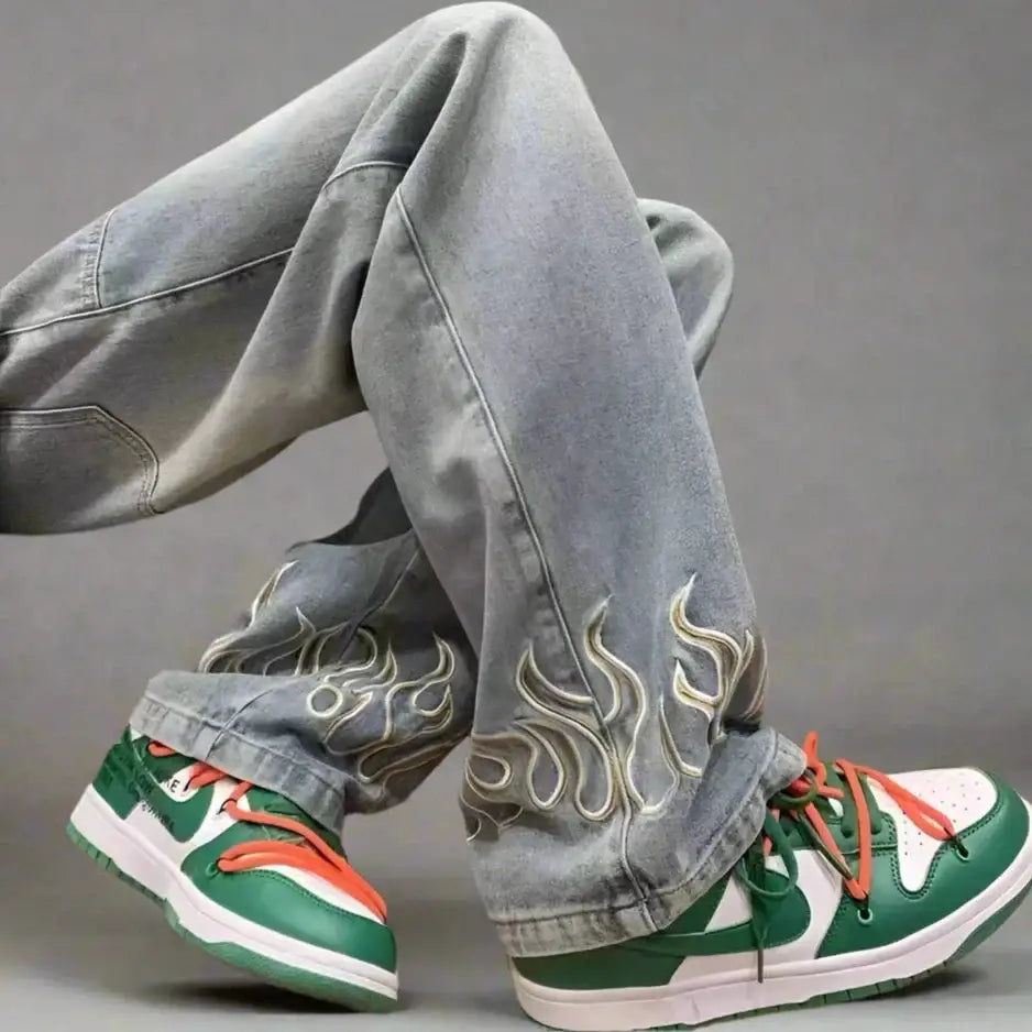 Pair of green and white sneakers with loose fit Flame Jeans and flame embroidery