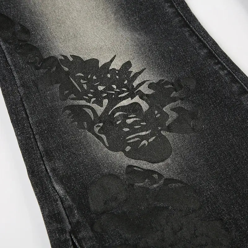 Black denim Floral Flare Jeans featuring a unique stylized face design printed on fabric