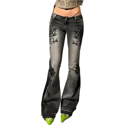 Faded gray floral flare jeans with black embroidery on the thighs for a Y2K look