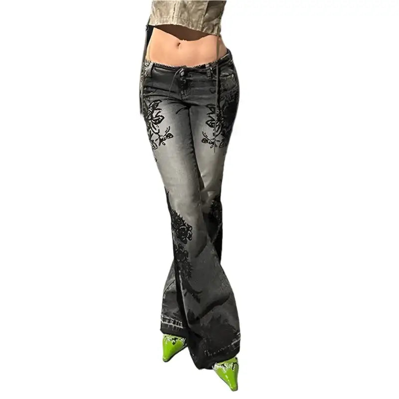 Floral Flare Jeans with black floral patterns and green pointed shoes displayed