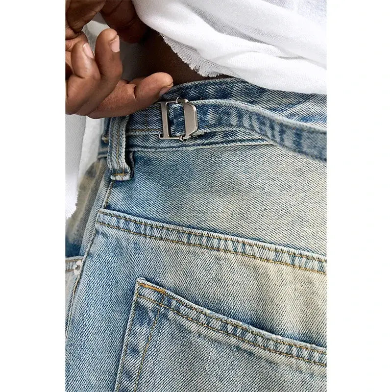 Light blue denim frayed hem shorts showcasing pockets and belt loop detail