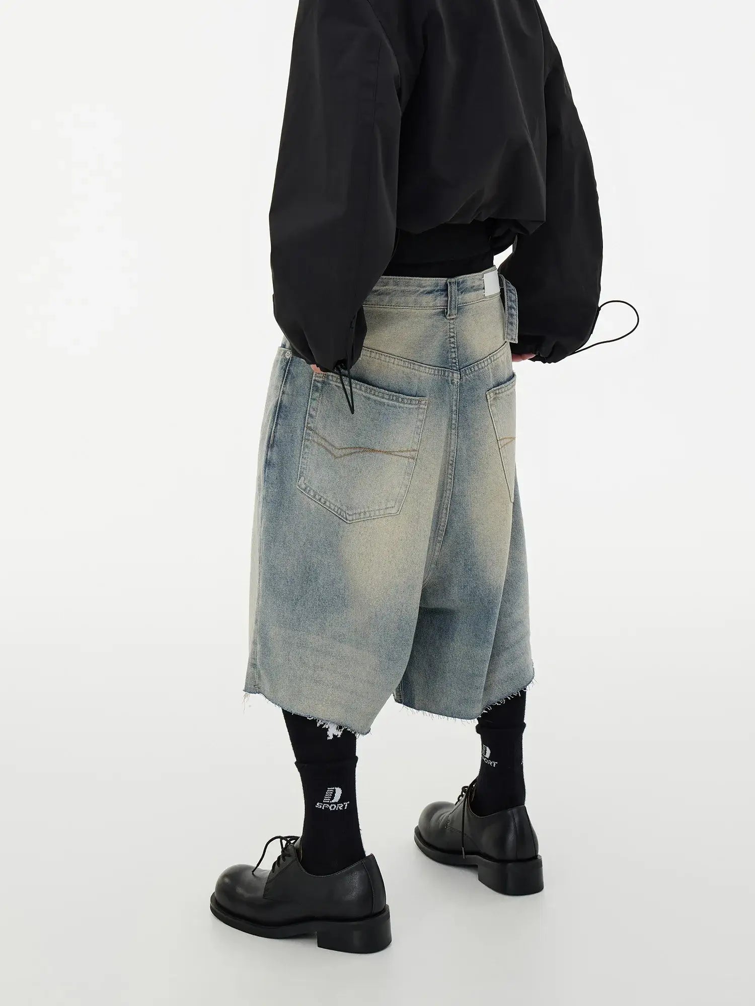 Wide-leg denim culottes with frayed hem and faded wash, perfect for summer frayed hem shorts