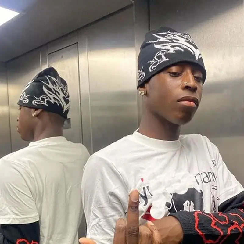 Young man in white t-shirt and patterned Gothic Beanie in an elevator setting