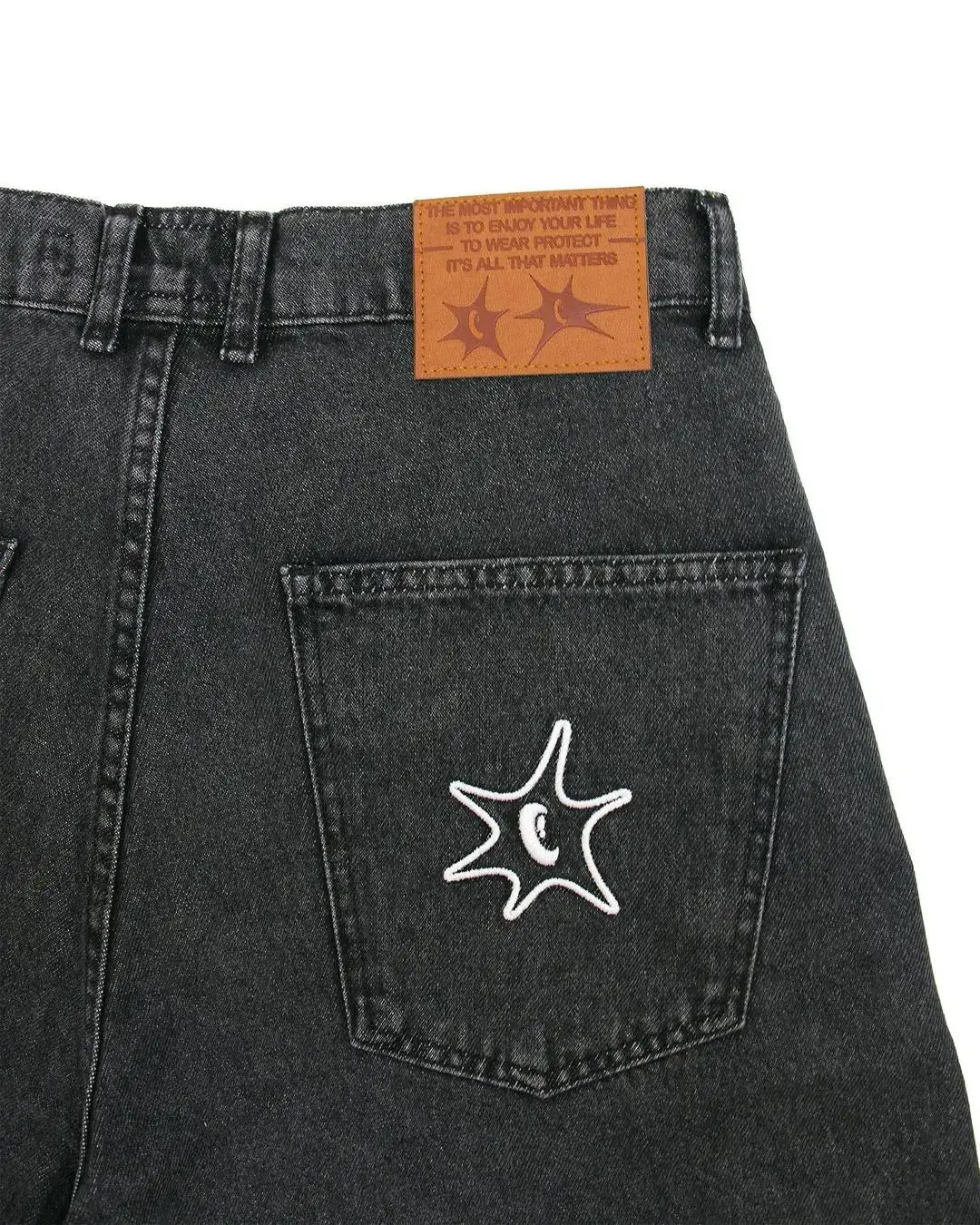 Black denim Graffiti Jorts with starfish embroidery and leather brand patch